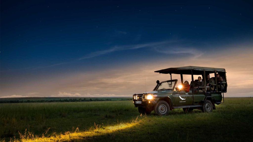 safari-vehicle-on-a-night-game-drive-in-the-masai-mara-with-andbeyond