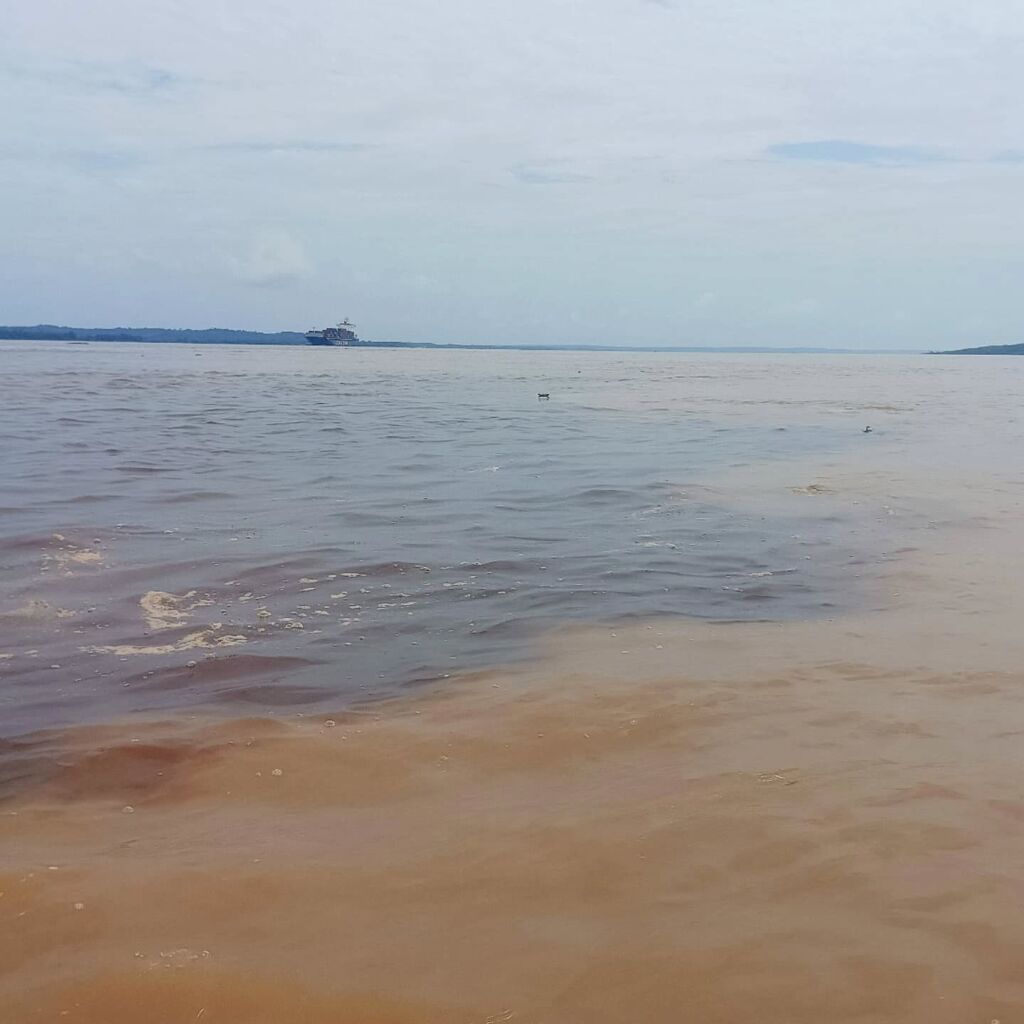 Rivers Rio Negro meets River Solimões Amazon Brazil