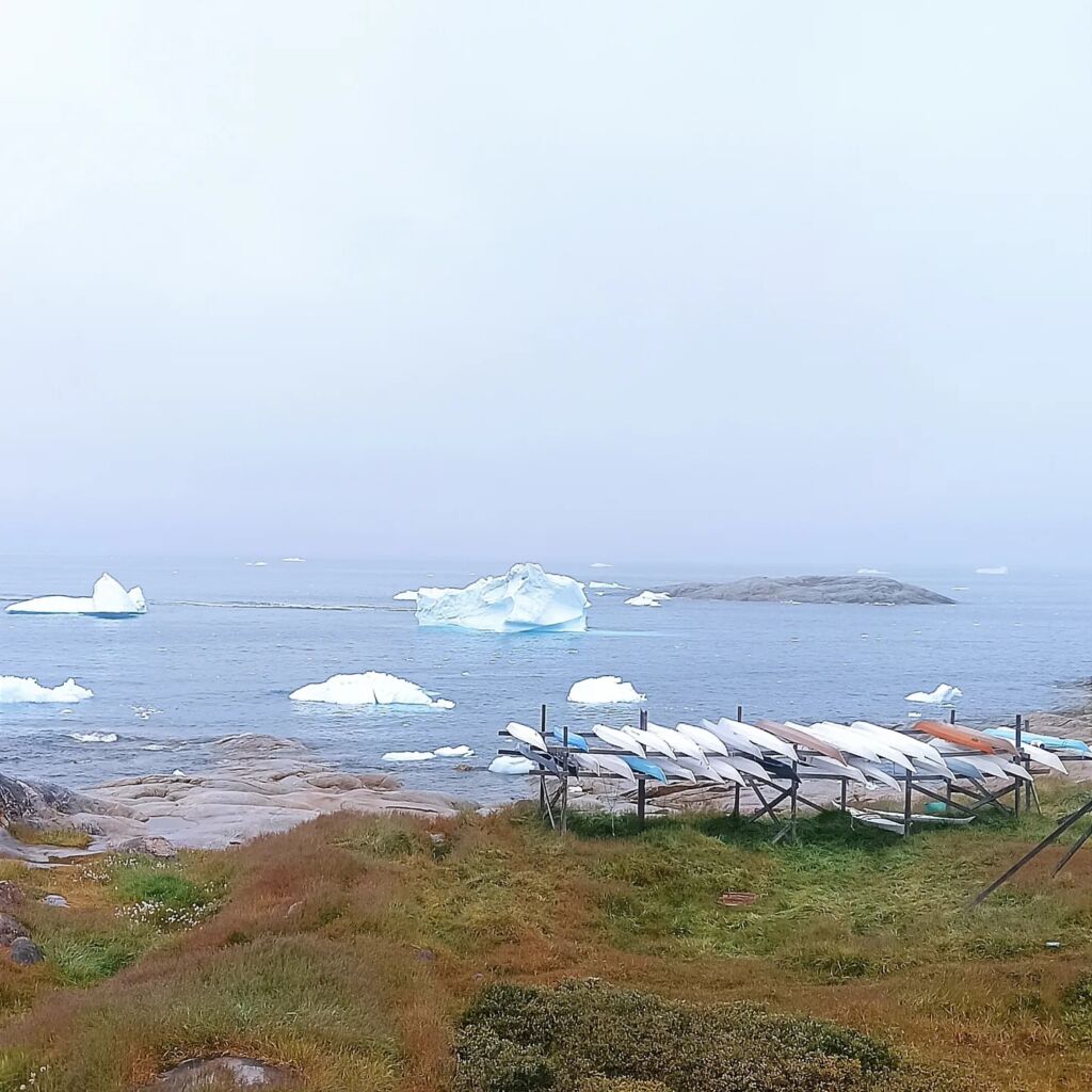 Boats by the bay Ilulissat Greenland